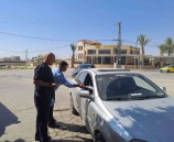 مركز الشرطة المجتمعي  المتنقل يوزع نشرات إرشادية على المواطنين في اريحا